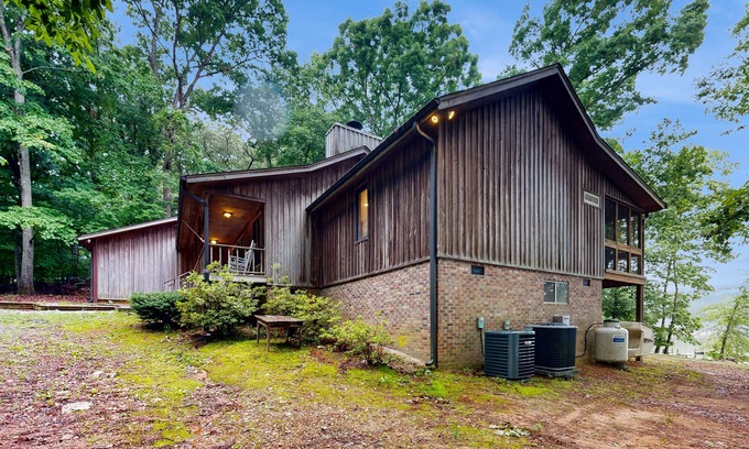 Leesville House | Lakefront home in the woods with dock, den, & private hot tub - dog-friendly