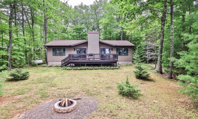 Lac du Flambeau House | Lakefront home with firepit, screened porch, WiFi, central AC, and kayaks