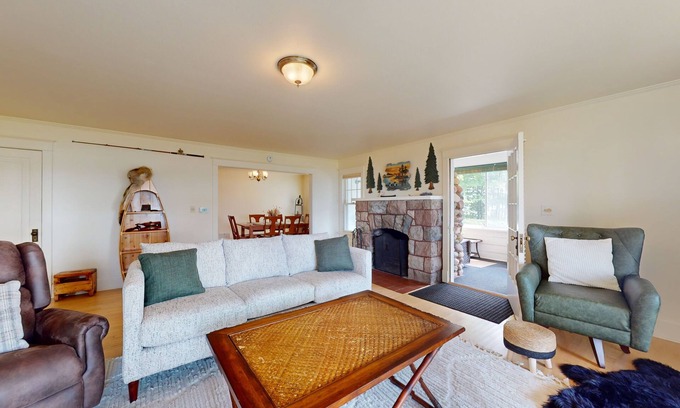 Phelps House | Lakefront home with large patio, docks, gas grill, fire pit, & WIFI