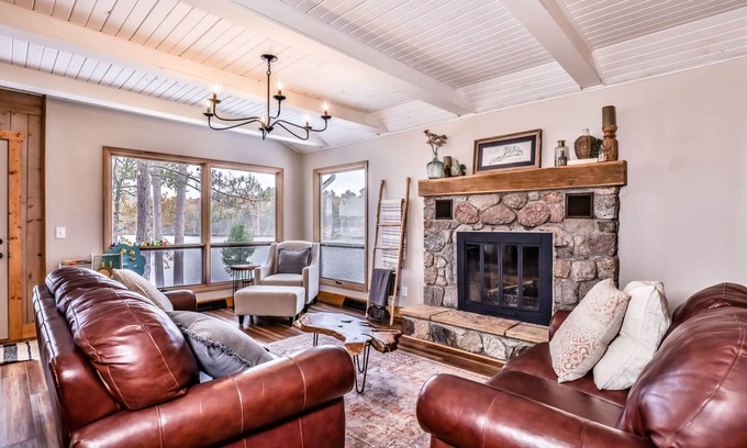 Sayner House | Lakefront home with private dock, deck, fireplace, firepit, canoe & paddleboat