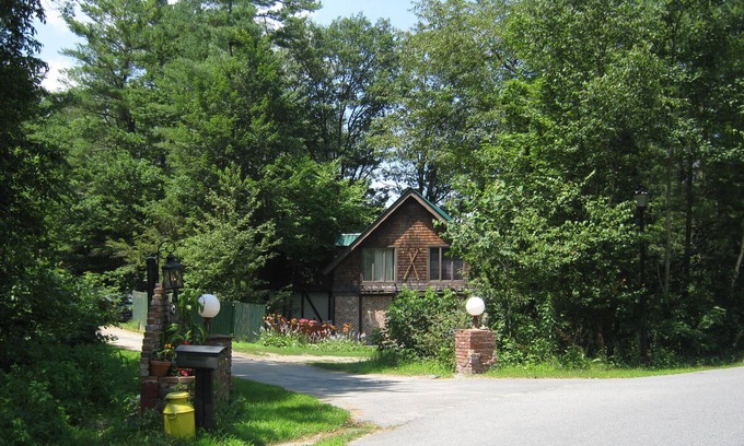 Warrensburg House | Lakehouse in wooded, Land Setting