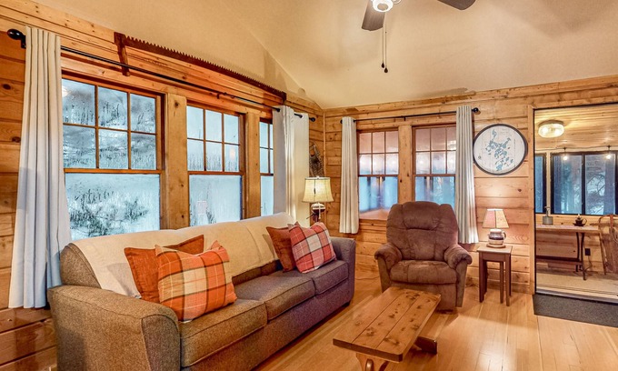 Three Lakes Cabin | Lakeside cabin with a firepit, sunroom, & seasonal dock