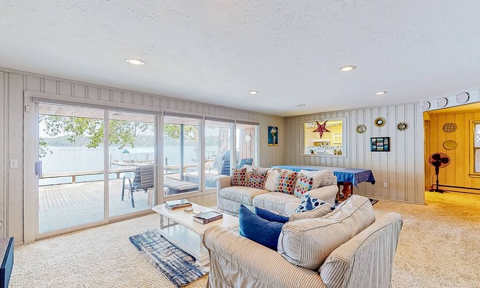 Clarksville House | Lakeside retreat with a dock, firepit, grill, board games, jetted tub, and W/D