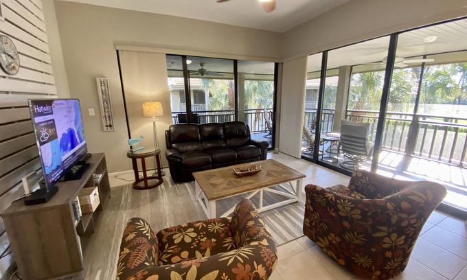 Bonita Bay Condo | LARGE 3RD. FLOOR CORNER UNIT W/GOLF COURSE VIEWS FROM SPACIOUS WRAP AROUND LANAI