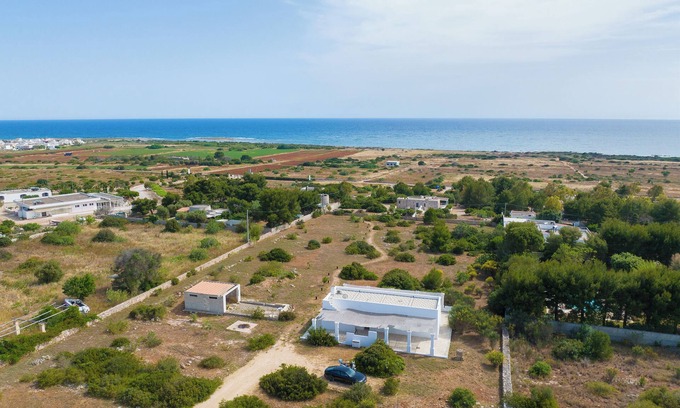 Torre Pali Villa | LiAMA Detached villa surrounded by greenery with panoramic sea views.