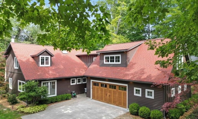 Fennville House | Listen to the waves in this charming, two-story home is nestled away on quiet &