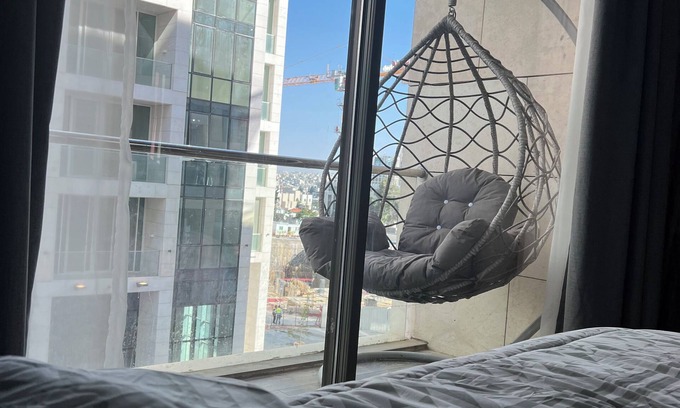 Al Abdali Apartment | Live in the heart of Amman with this luxury one-bedroom suite featuring two balc