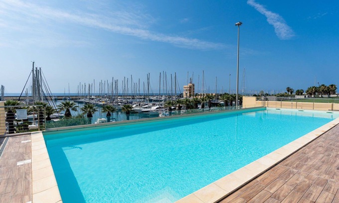 Santo Stefano al Mare Apartment | Lovely apartment for 4 people with A/C, WIFI, pool, TV and terrace