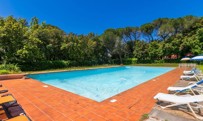 Rosignano Marittimo Apartment | Lovely apartment for 7 people with WIFI, pool, TV and patio