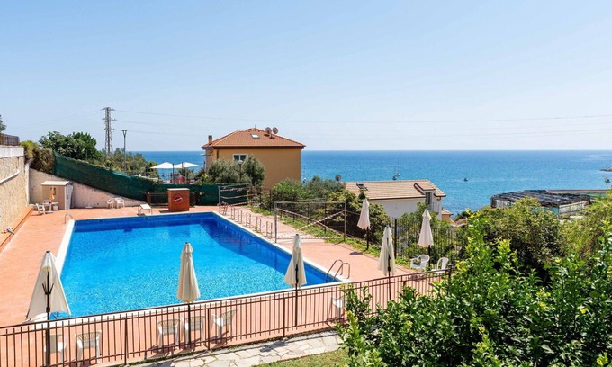 Cipressa Apartment | Lovely apartment for 4 guests with pool, WIFI, balcony and parking