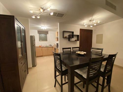 Aqaba Apartment | Lovely first floor tow bed rooms overviewing circular pool for families only in Talabay Aqaba