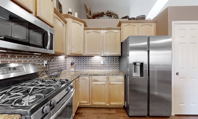 Greeley House | Lovely home with an enclosed yard, fireplace, pool table, games, W/D, & AC