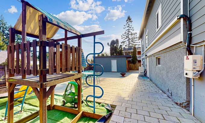 Haller Lake House | Lower-level home with spacious fenced backyard, playground, BBQ, firepit