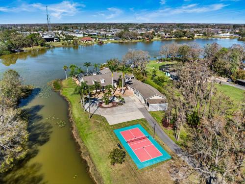 Westchase House | Luxe Waterfront Hideaway w Pool Pirate Ship Dock