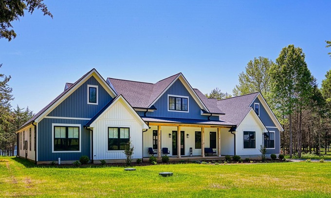 Louisa House | Luxurious lakeside home with private dock, beach, patio, & game room - dogs OK