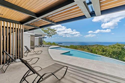 Rio Seco House | Luxurious Ultramodern Property with Private Suites, Infinity Pool, and Sweeping Ocean and Mountain Views