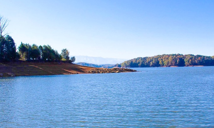 Baneberry Cabin | Luxury lakefront cabin with free attraction tickets, fire pit, dock & deck