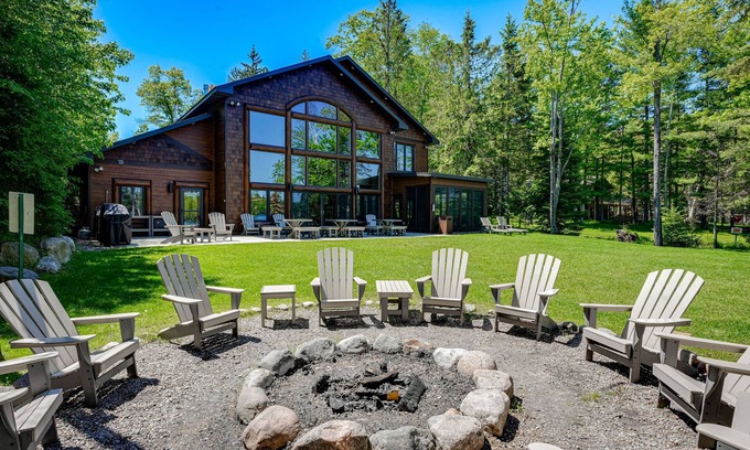 Eagle River House | Luxury lakefront home with high-speed WiFi, dock, private beach, & theater room
