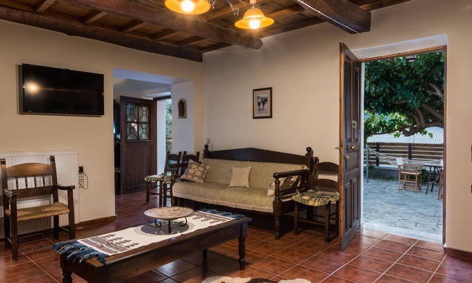 Psathoyiannos Cottage | Maro's village hall. Private & Serene Stone Villa