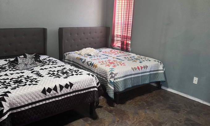 Greenacres Apartment | Master bedroom with private restroom and private entrance. Two full beds+ futon