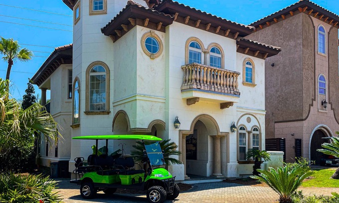 St. Tropez House | Mediterranean-style home with pool & hot tub access, W/D, AC & golf cart