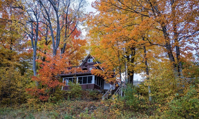 Cornell Ski Chalet | Michigans Upper Peninsula ON the Escanaba River with wooded 5 acres of Privacy.