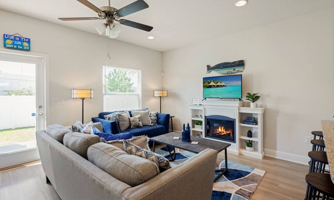 Thomas Drive House | Modern 3BR Townhome | Pool Access | Near Publix Sports Park & Beaches | Sleeps 9