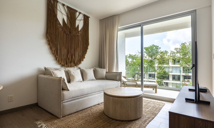Playacar Condo | Modern, family-friendly condo with pool view, full kitchen & WiFi