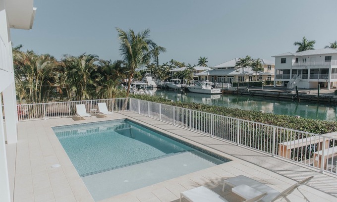 Key Colony Beach House | Modern Island Luxury | 4 En-Suite Masters, 6 BA, Pool, Dock & Outdoor Oasis