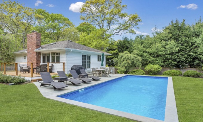 East Hampton House | Modern-style home with private pool, open-floor living plan, back porch,.