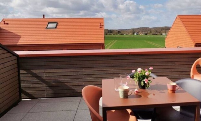 Hohwacht Apartment | Modern two-story apartment with rooftop terrace.