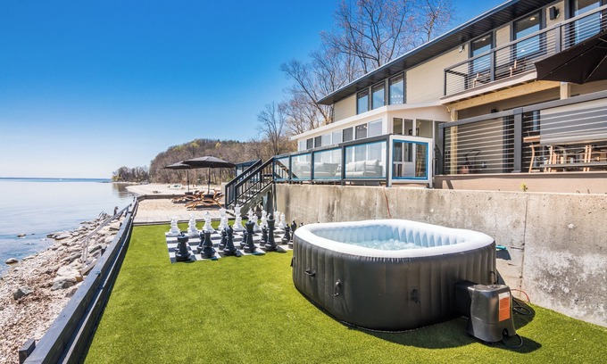Traverse City House | NEW! Bay Shore Retreat – Hot Tub, Games & Mins to Downtown TC! ➠ 7345