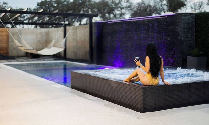 Concan House | NEW Glam Modern Luxury Home by River! Pool Hot Tub Movie Room Firepit Sleeps 24