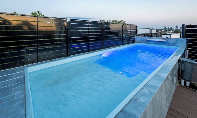 Katie Hill Neighborhood House | NEW HOME - Luxe Skyline Views - 20' Heated Rooftop Pool