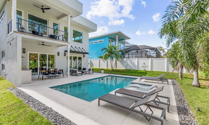 Ridge Wood Heights House | New modern home with salt water heated pool located minutes from SiestaKey Beach