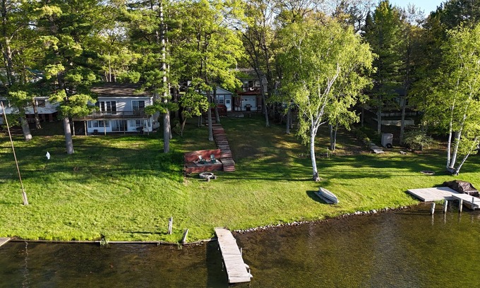 National City House | New! Seven Oaks at Bass Lake - Beautiful Lakefront Getaway with Dock and Canoe!