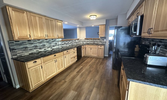 Waldo House | NEW Three bedroom ranch style pet friendly home with a patio & theatre room!