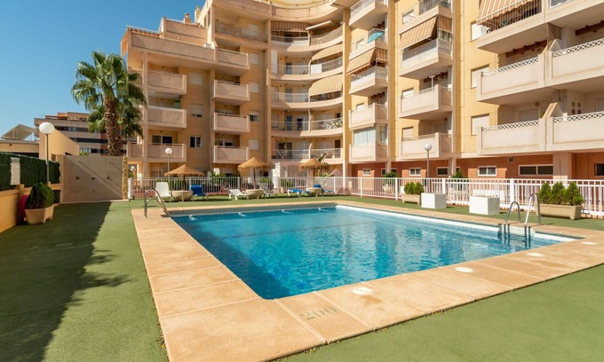 Roquetas de Mar Apartment | Nice apartment for 4 guests with A/C, WIFI, pool, TV, terrace and pets allowed