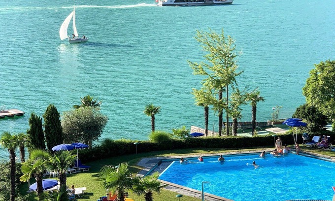 Bissone Apartment | Nice apartment for 4 guests with pool, WIFI, A/C, TV, balcony, panoramic view and parking