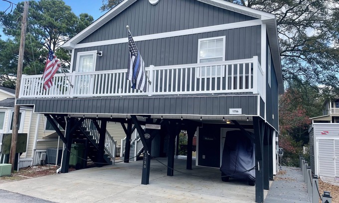 Surfside Beach House | Ocean Lakes -Site 1756 Outdoor seating area w/firepit. Serene canal views!