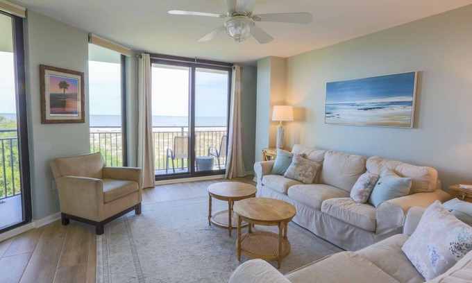 Isle of Palms Condo | Oceanfront, Renovated Corner Condo with Ocean Views, Community Pool. Yards from Beach