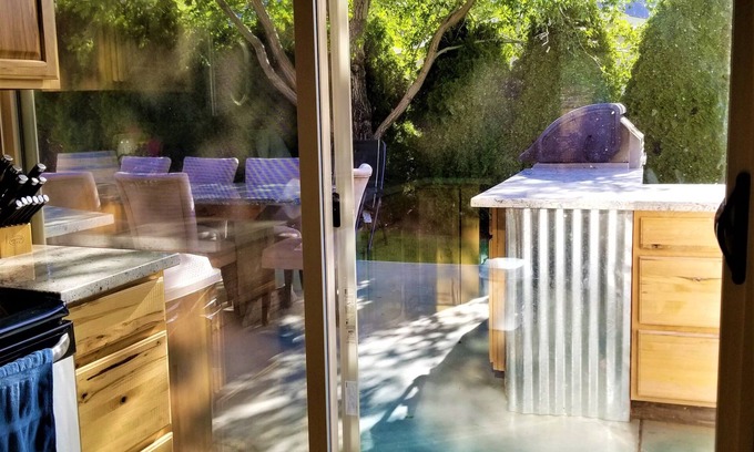 Sunland Estates House | Outdoor kitchen with grill and professional griddle