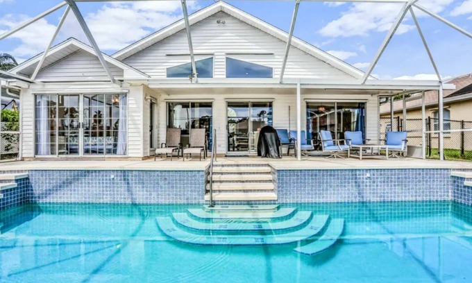 Palm Harbor House | Peaceful Waterfront Pool Home by RedAwning
