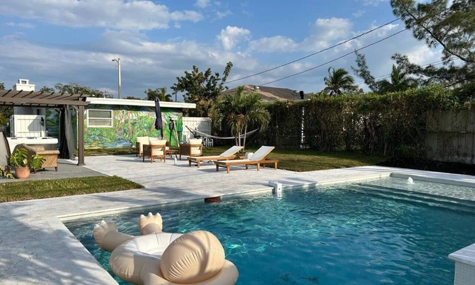 Lake Worth Cottage | Pool, Hot tub, 5 min to beach! The Monkey Cottage!