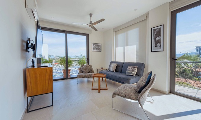 North Hotel Zone Condo | Porto Santo beautiful 1 bedroom flex, king bed+sofa bed steps from playa de oro.