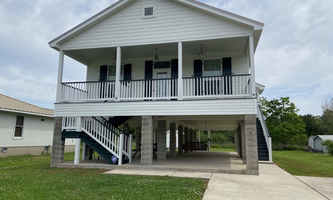Waveland House | Pretty raised three bedroom beach home awaits you! A short 3 min. walk to beach!