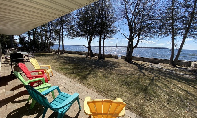 Little Sturgeon House | Prime sunsets, great kayaking, huge yard, volleyball court, and free firewood