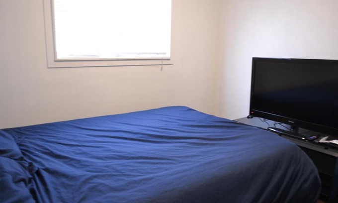 Southeast Calgary House | Private bedroom on renovated duplex main floor - Dover