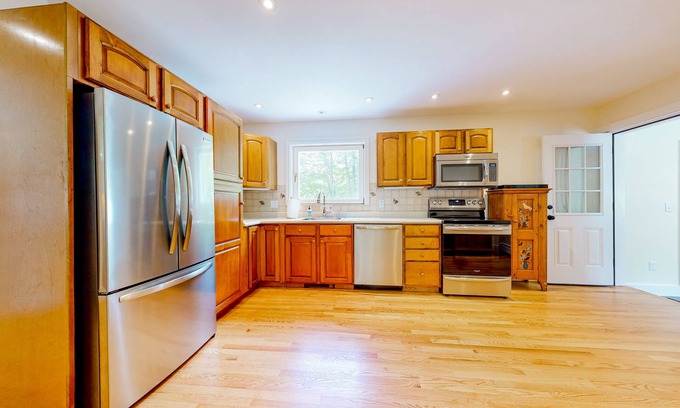 Manchester House | Private home with fireplace, grill, games, AC & great Manchester location
