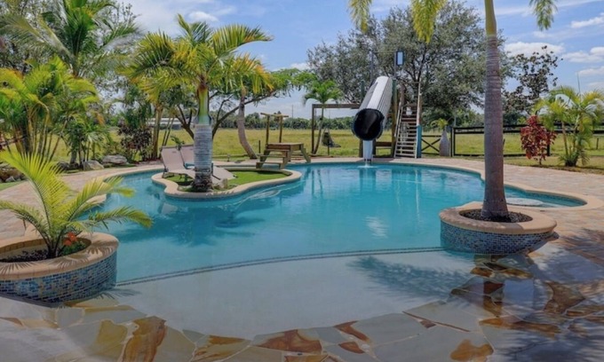 White City House | Private Tropical Oasis 4/2 Home with Resort Style Pool & Waterslide
